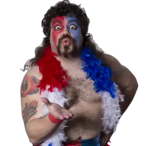 Sassy Bear a large man with brown mullet hair and goatee beard. Wearing Red and blue face paint and a matching red white a blue feather boa