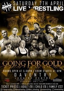 A large collection of WIN Wrestlers posed in front of an oversized championship belt in the background