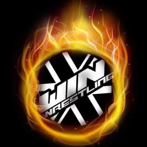 A black and white win Wrestling logo surrounded by flames