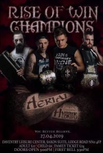 Big title rise of Win Champions with CJ Carter holding a briefcase, the Aerial Hybrids stand with the tag team titles next to the man known as fowler with the WIN championship. Under that there are two tattooed arms that read aerial hybrids.