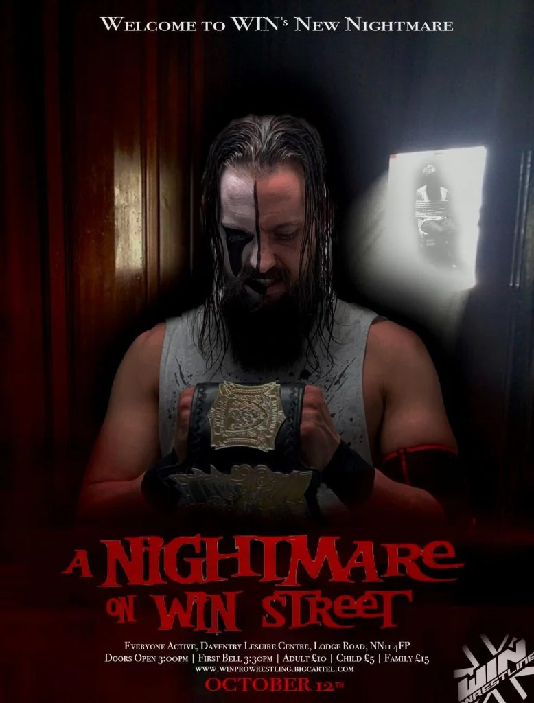 CJ carter stands looking menacingly at his WIN Championship in front of what looks like a spooky interior.