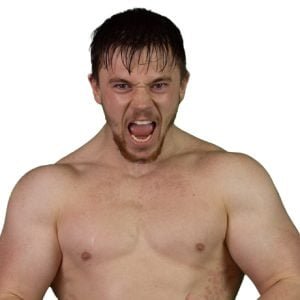 Ross Lee stands in an energetic pose shouting to camera