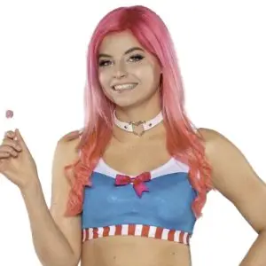 Candyfloss is a young woman with pink hair in blue white and red clothing