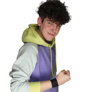 Connor stands looking menacingly at camera in a multi colour hoodie and black wrist tape