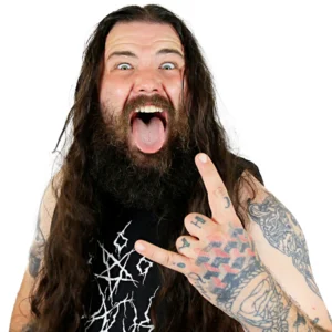 Dave stands in a rock pose wearing a black T-shirt sticking his tongue out