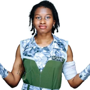 Ronnie wears a blue camouflage and green boiler suit