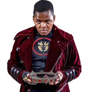 TJ wears a red velvet jacket while holding a crown