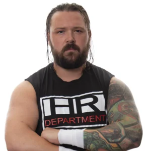 razor stands in his HR shirt arms folded