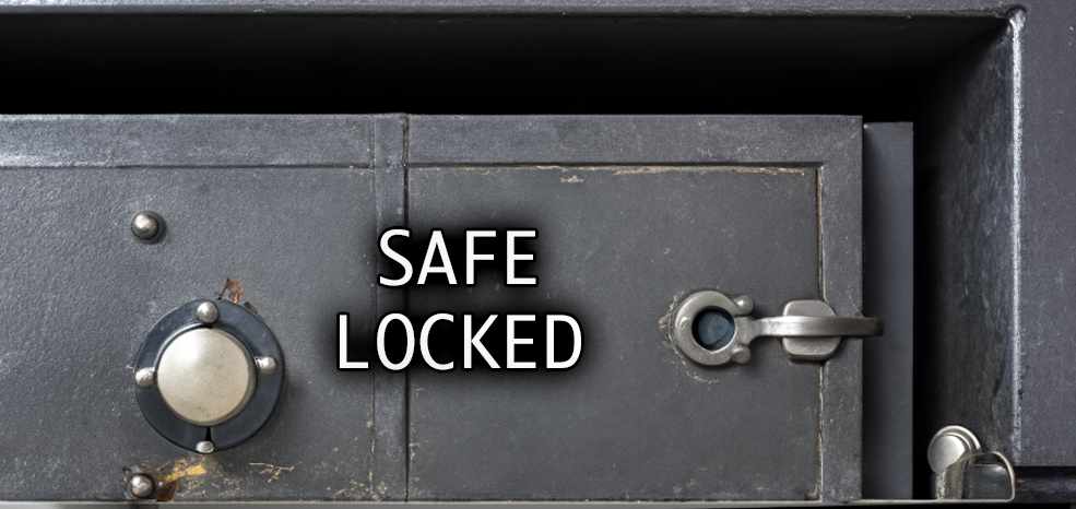 An old grey metal safe with the words safe locked written on the front